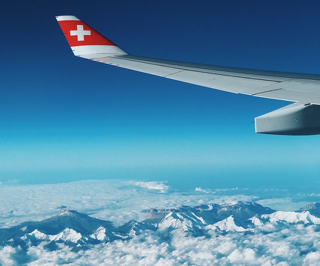 swiss-air-airplane-above-clouds