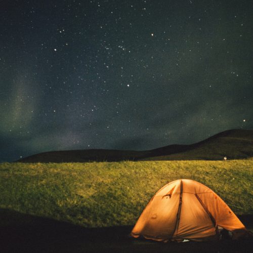 camping-orange-tent-field