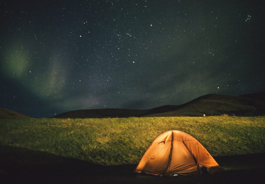 camping-orange-tent-field
